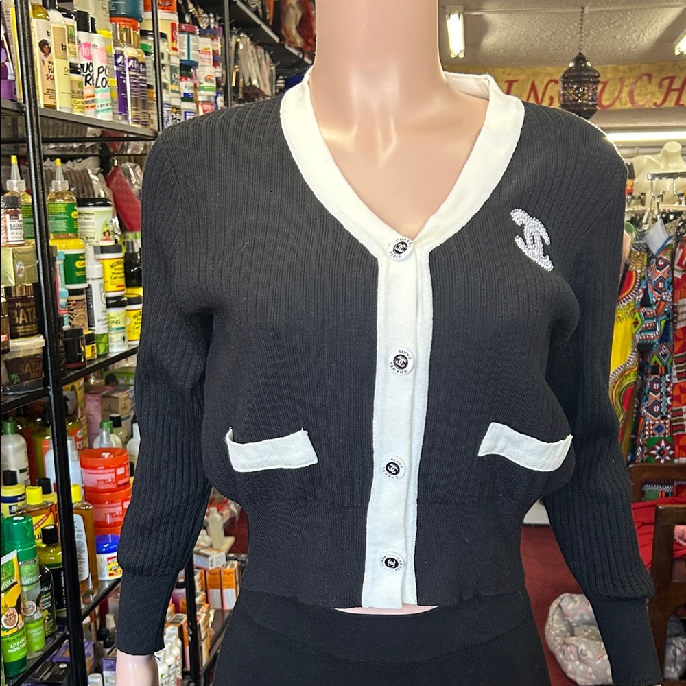 CHANEL Elegant Black Cardigan with White Accents